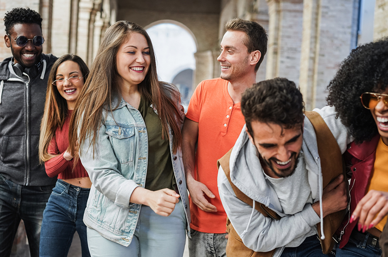 Friends walk and laugh together