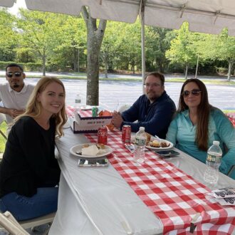 Team members enjoying bbq