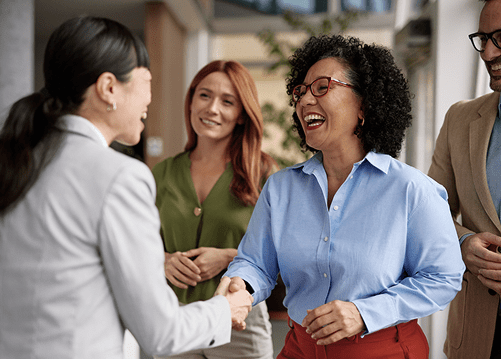 Two woman shaking hands