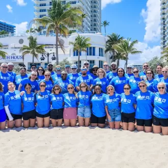 Team photo on a beach