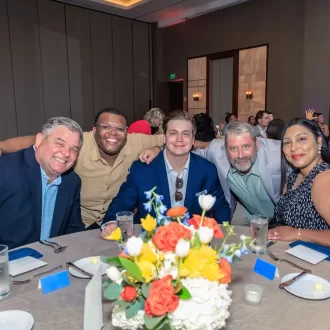 Group photo at a dinner table